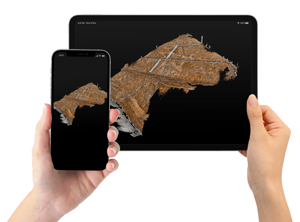 スマートフォン・タブレットで土構造物などの測量対象をスキャンしている写真